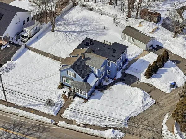 a wooden bench sitting in middle of a yard