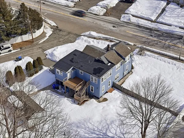 a kitchen with stainless steel appliances granite countertop a stove top oven a sink and dishwasher a refrigerator with wooden floor