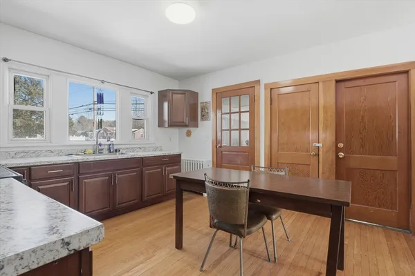 a kitchen with stainless steel appliances granite countertop a stove microwave and sink