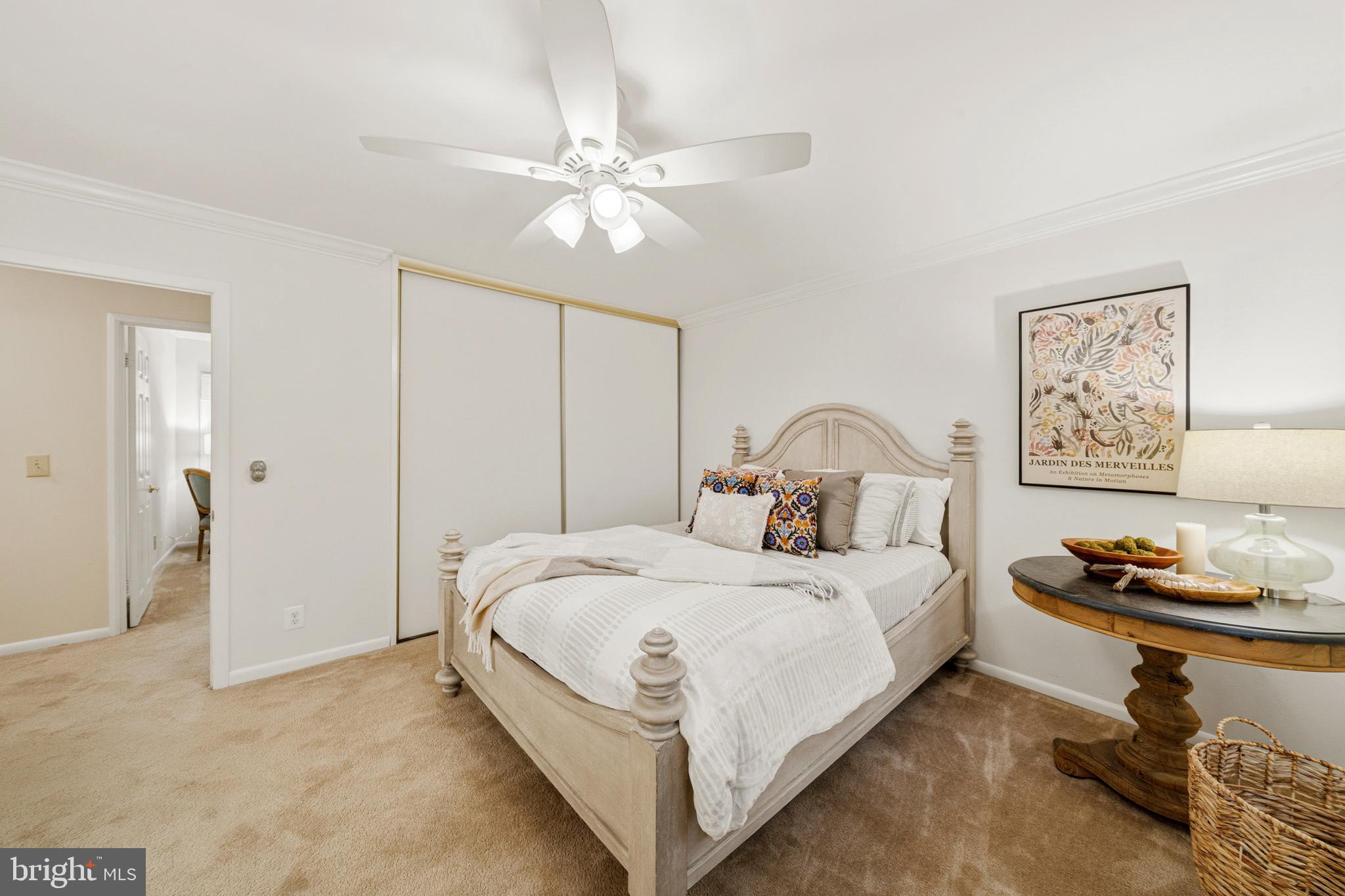 14601 Deerhurst Terrace Silver Spring, MD 20906 - Photo 20 of 51 a bedroom with a bed and a chandelier