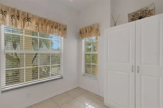 a kitchen with cabinets appliances a sink and a window