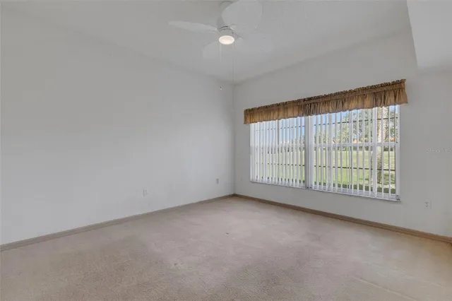 a bathroom with a sink mirror and toilet