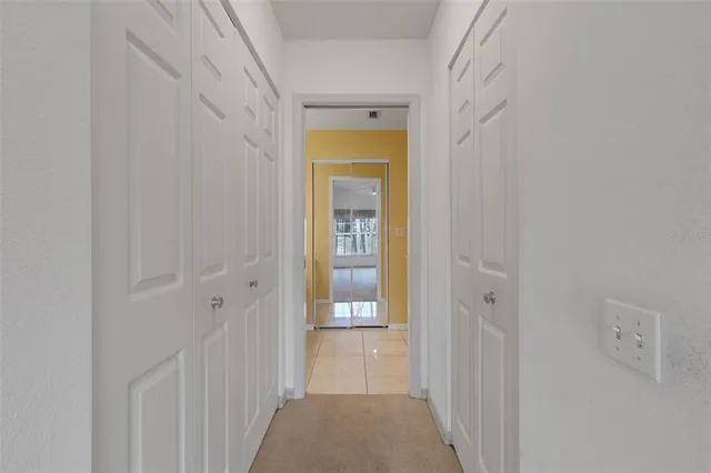 a view of a house with potted plants