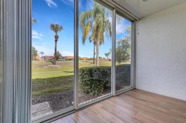 an aerial view of a house with a garden and lake view