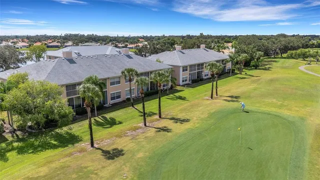 an aerial view of a house with outdoor space