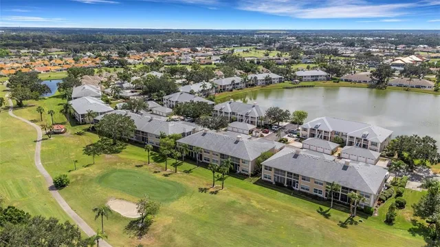an aerial view of a house with a swimming pool