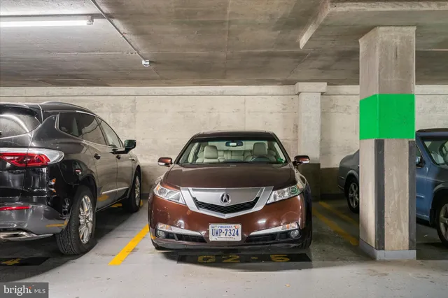 a lobby with furniture and floor to ceiling window