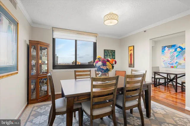 a dining room with furniture and window