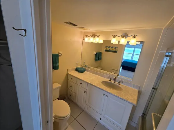 a bathroom with a double vanity sink and mirror