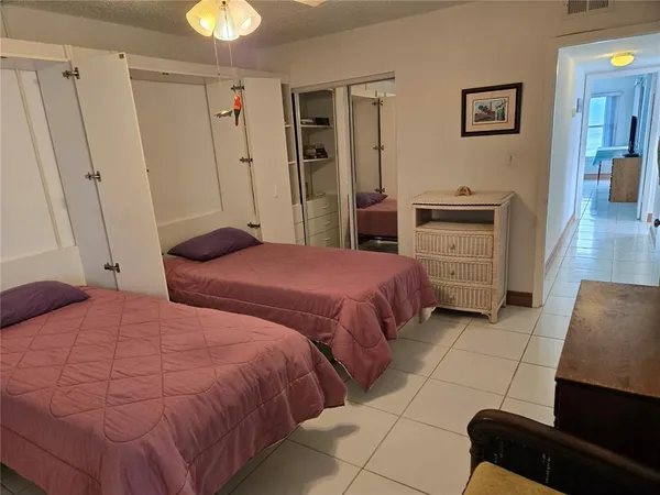 a bedroom with a bed and a walk in closet