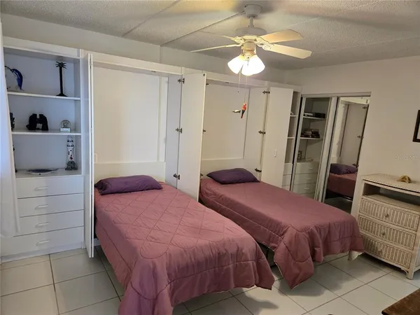 a bedroom with a bed and a mirror