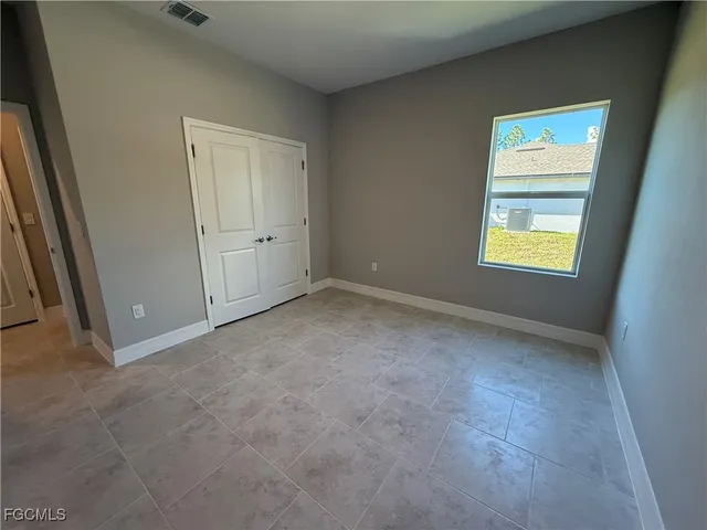 a white toilet sitting next to a bathroom sink and tub