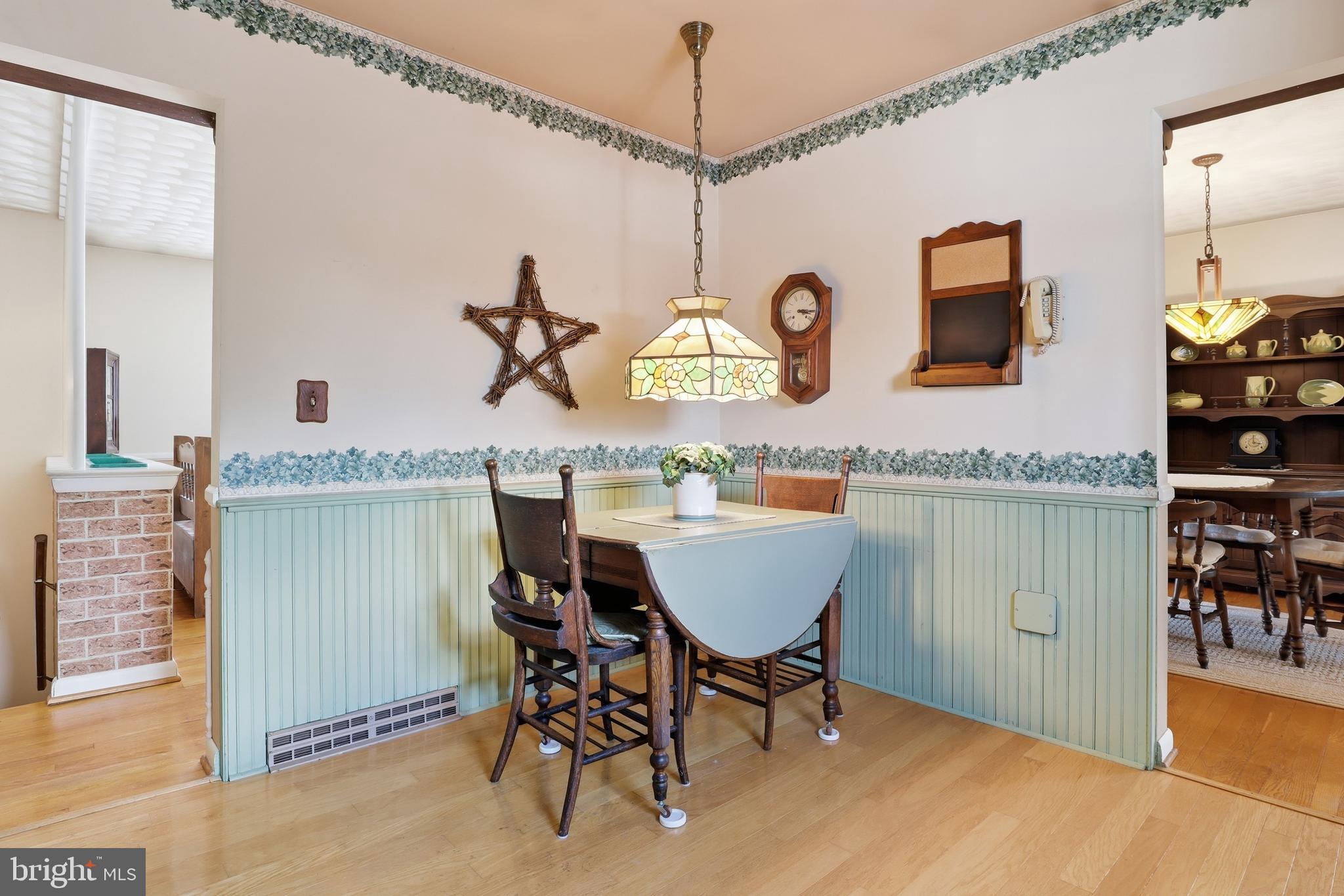 5200 Harmony Grove Road Dover, PA 17315 - Photo 12 of 50 a dining table chairs next to a window and kitchen view
