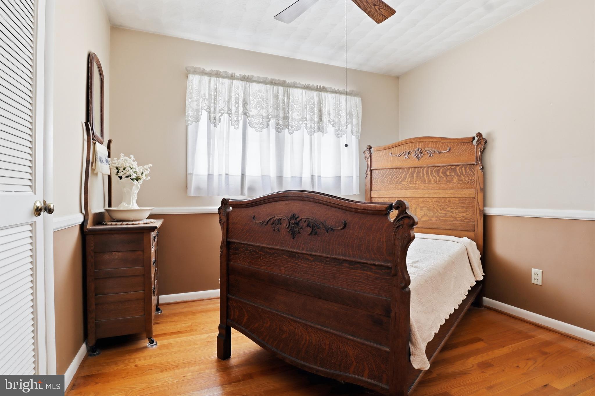 5200 Harmony Grove Road Dover, PA 17315 - Photo 16 of 50 a bed room with a bed and a dresser