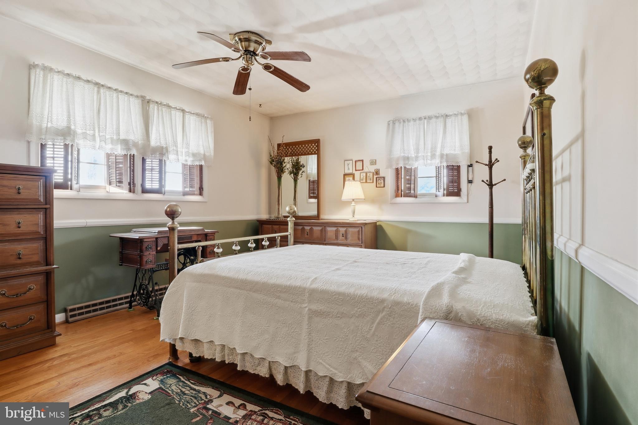 5200 Harmony Grove Road Dover, PA 17315 - Photo 18 of 50 a bedroom with a bed and a chandelier