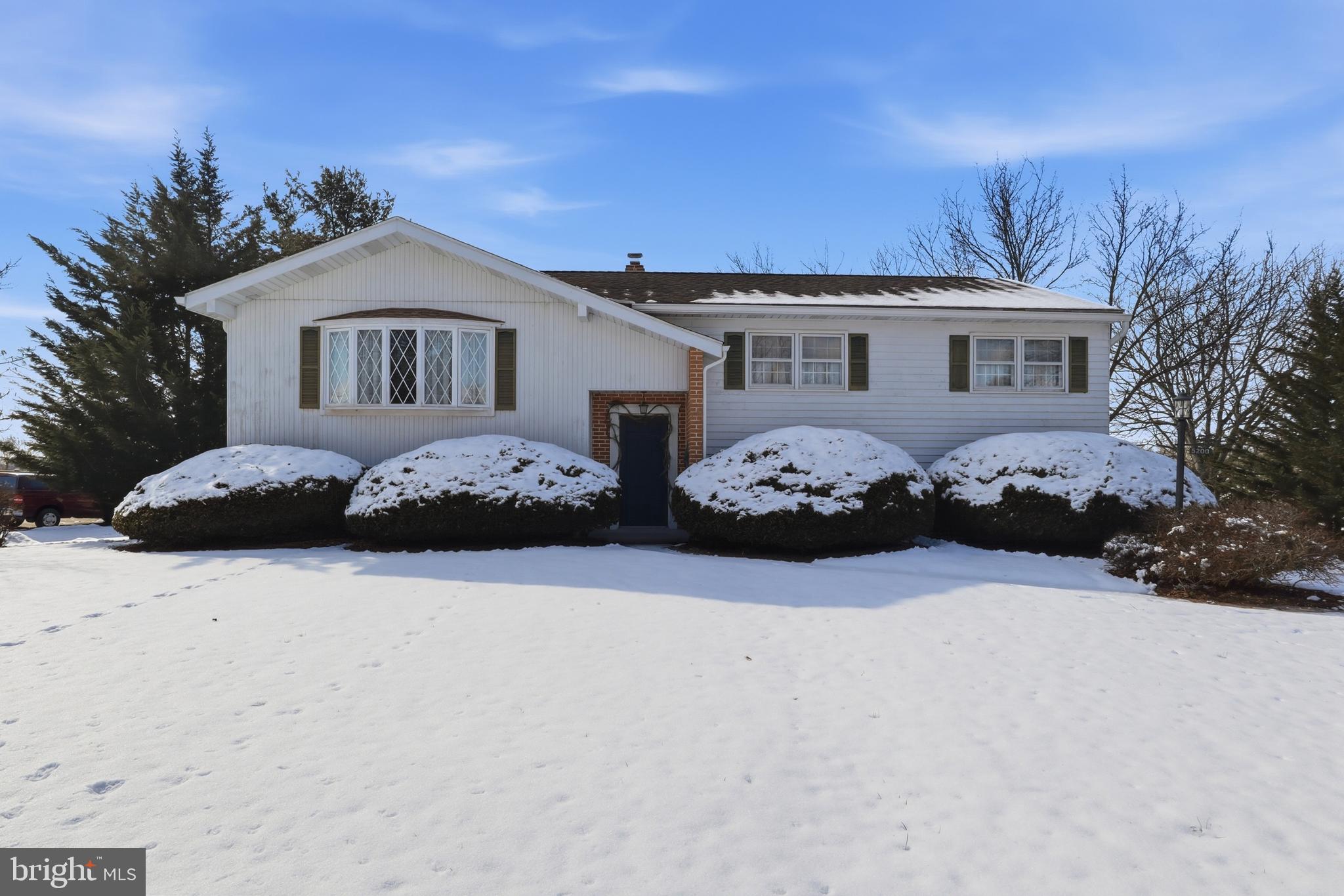 5200 Harmony Grove Road Dover, PA 17315 - Photo 2 of 50 a front view of a house with a yard covered in snow