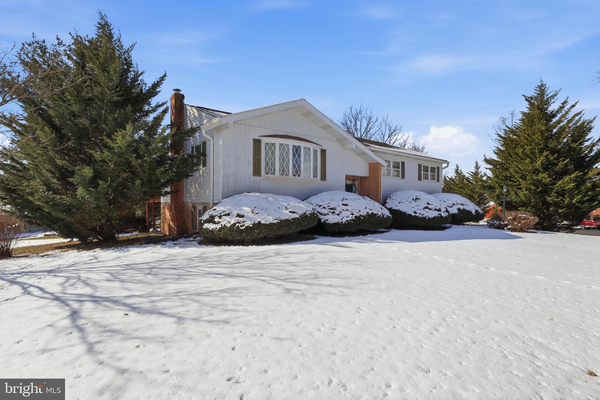 5200 Harmony Grove Road Dover, PA 17315 - Photo 3 of 50 a front view of a house with a yard covered in snow