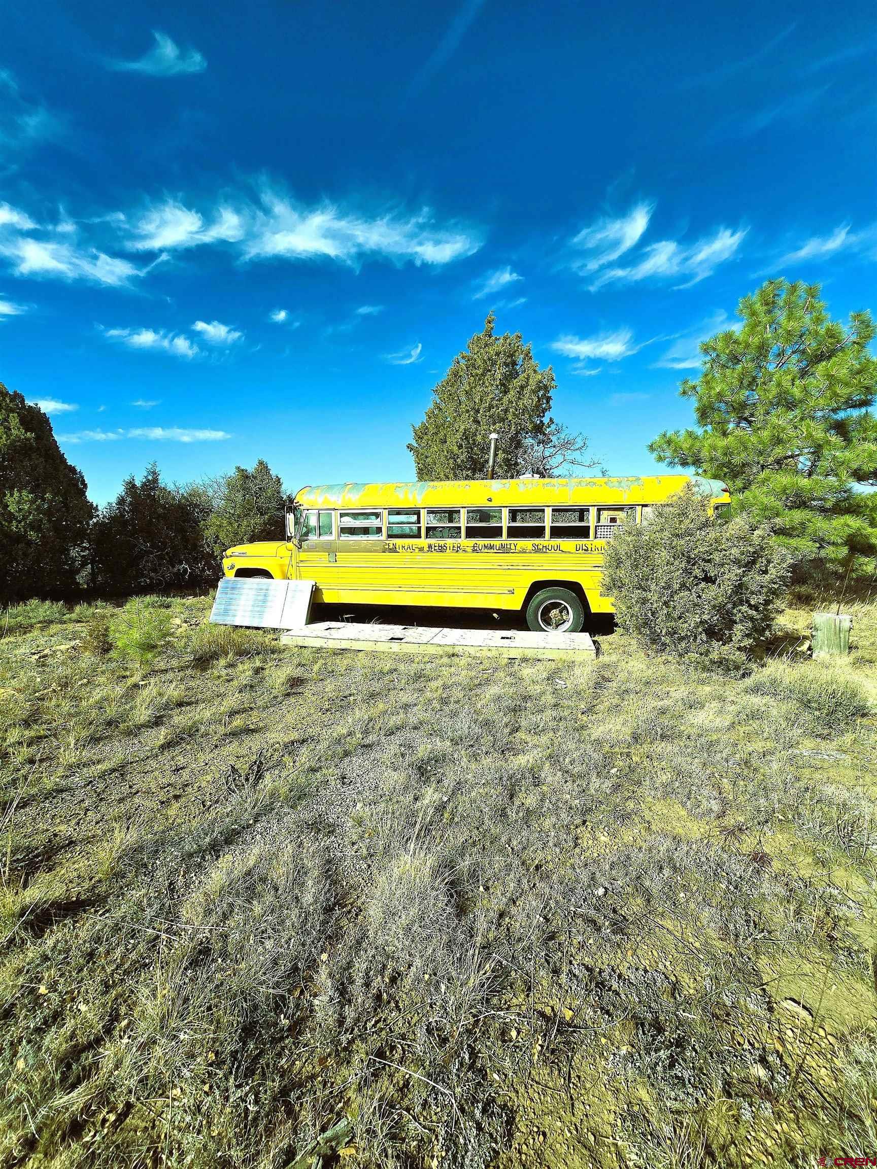 2 A West Beaver Pines Loop Norwood, CO 81423 - Photo 24 of 38 a view of a swimming pool with an outdoor space and seating area