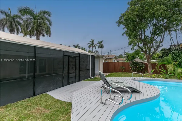 a view of a backyard with a patio and plants