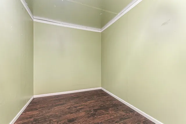 a bathroom with a granite countertop sink a mirror a bathtub and shower