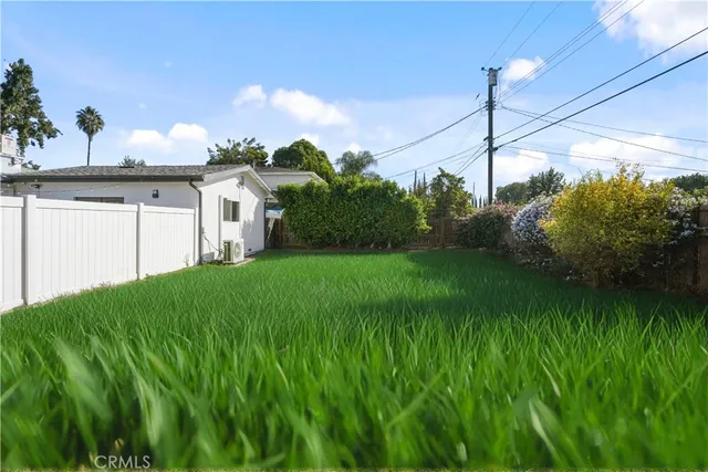 a house view with a garden space