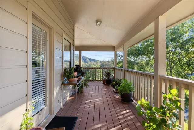 a view of a balcony with chairs