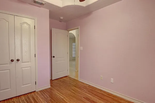a view of a house with pool and a yard