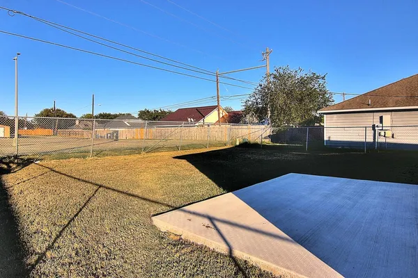 a view of a swimming pool with a yard