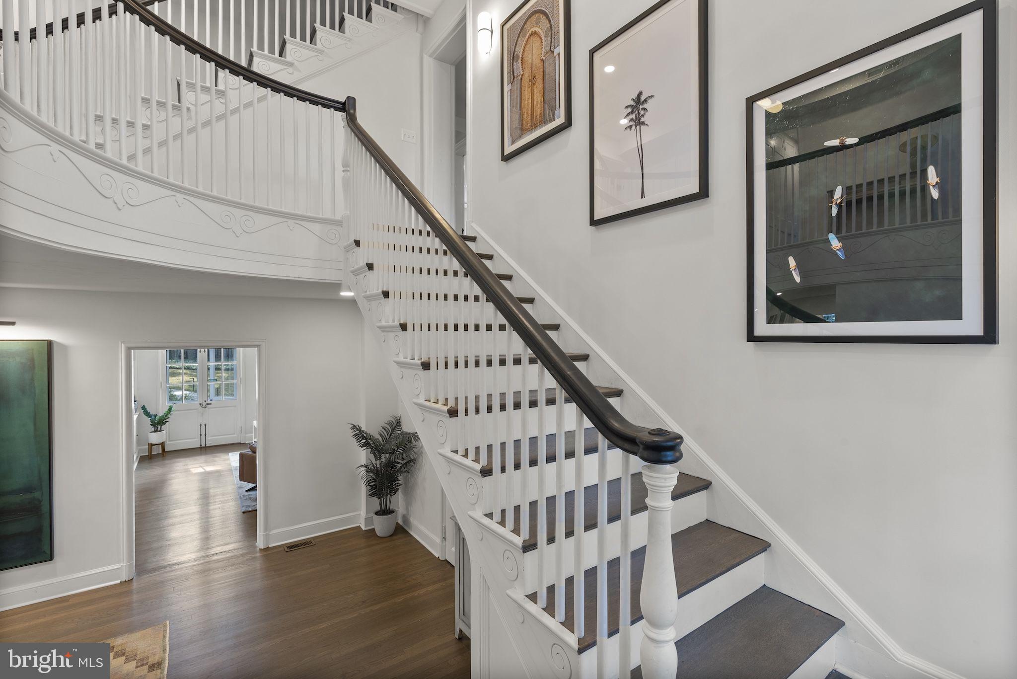 203 East Highfield Road Baltimore, MD 21218 - Photo 12 of 49 a view of staircase with white walls and a window