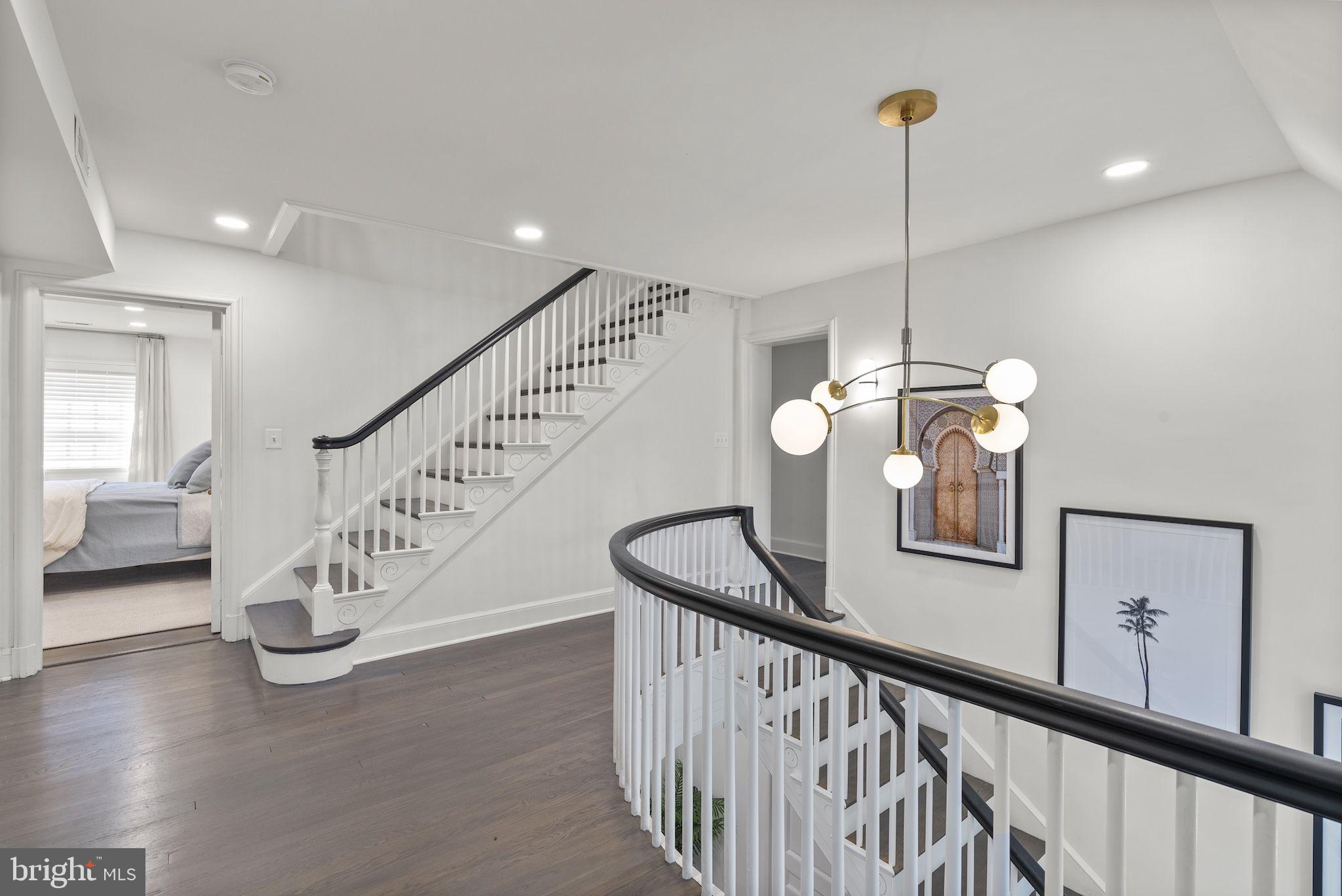 203 East Highfield Road Baltimore, MD 21218 - Photo 13 of 49 a view of an entryway wooden floor and a chandelier