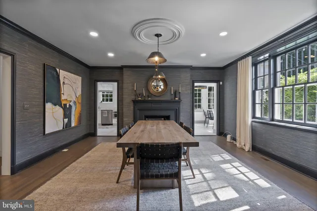 a large kitchen with a table and chairs