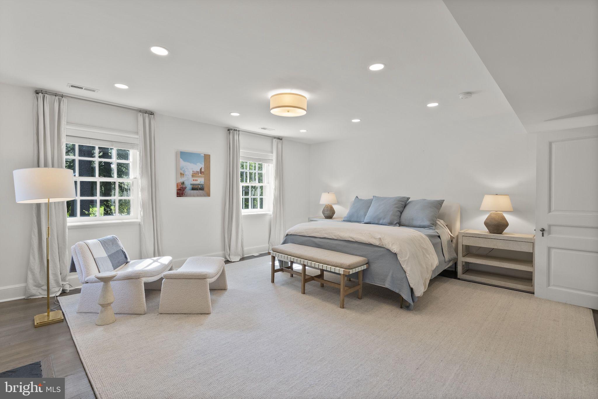 203 East Highfield Road Baltimore, MD 21218 - Photo 24 of 49 a bedroom with a bed and wooden floor