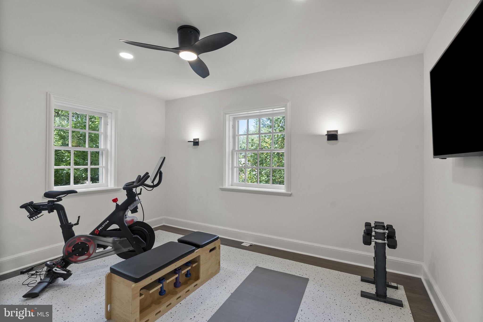 203 East Highfield Road Baltimore, MD 21218 - Photo 32 of 49 a room with gym equipment and windows