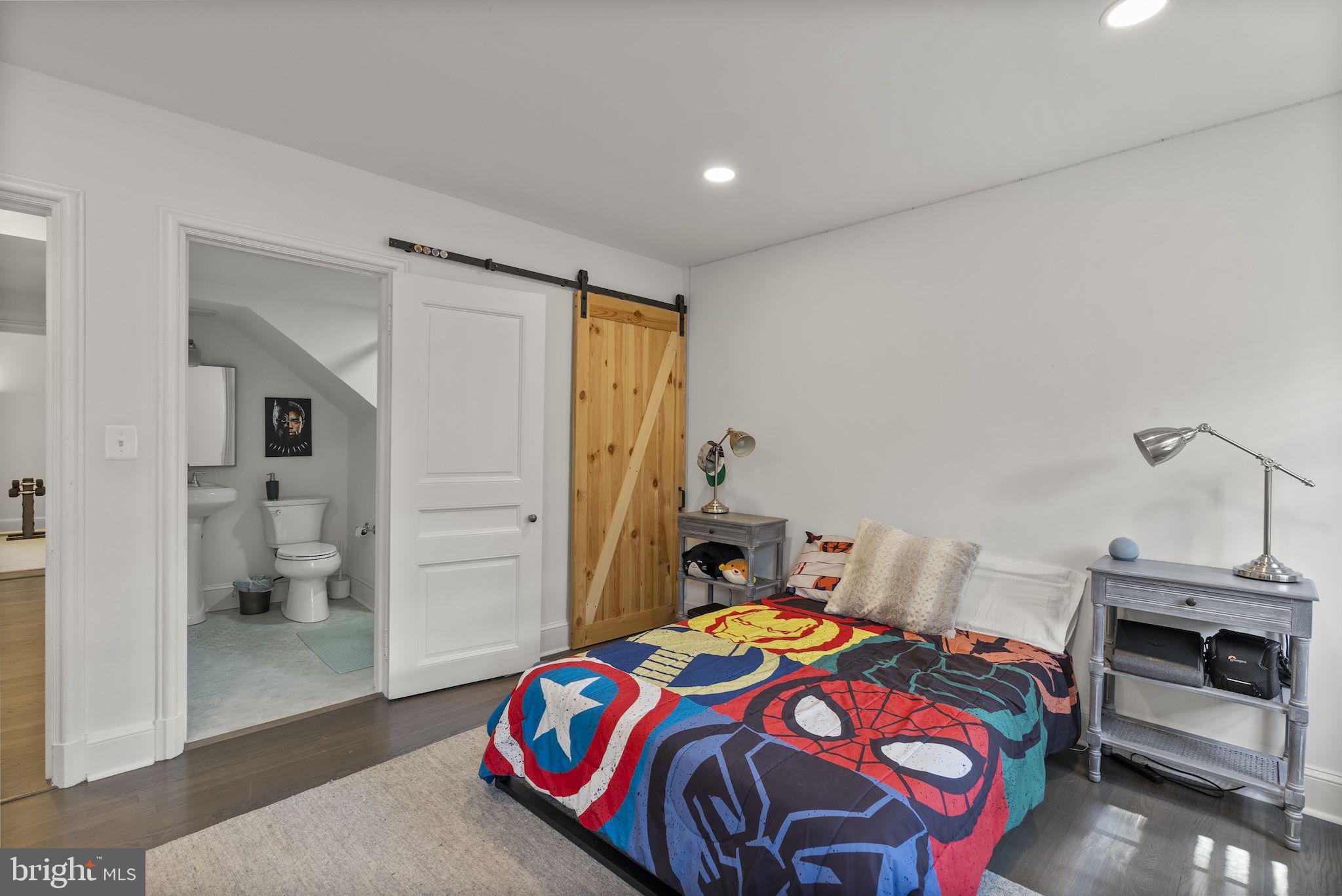 203 East Highfield Road Baltimore, MD 21218 - Photo 33 of 49 a bedroom with a bed and a view of bathroom