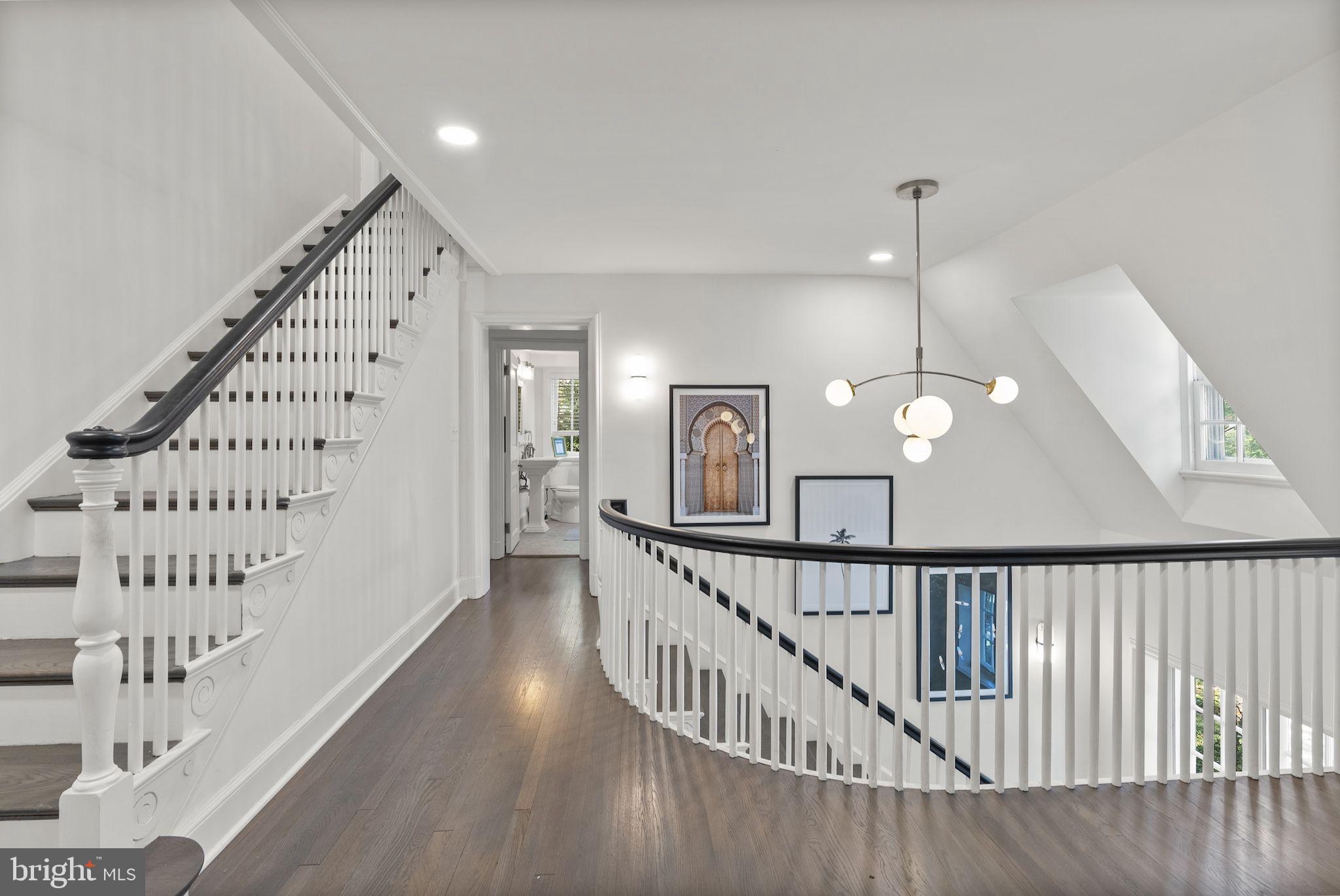 203 East Highfield Road Baltimore, MD 21218 - Photo 35 of 49 a view of a hallway with staircase