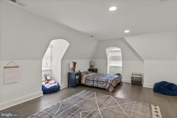 a bedroom with bed and window