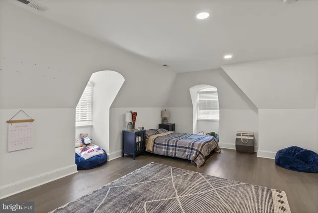 a bedroom with bed and window