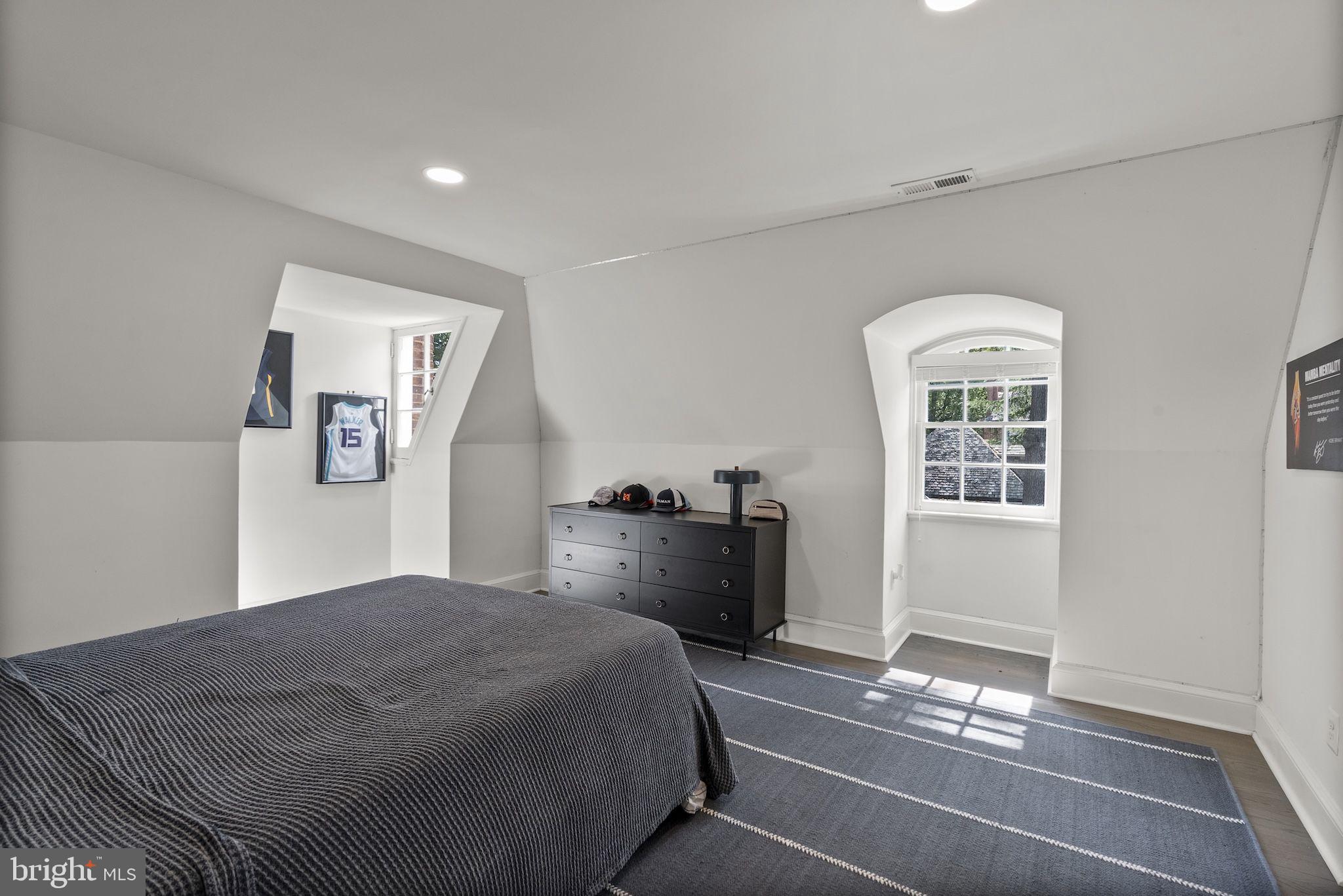 203 East Highfield Road Baltimore, MD 21218 - Photo 38 of 49 a bedroom with a bed and a chandelier