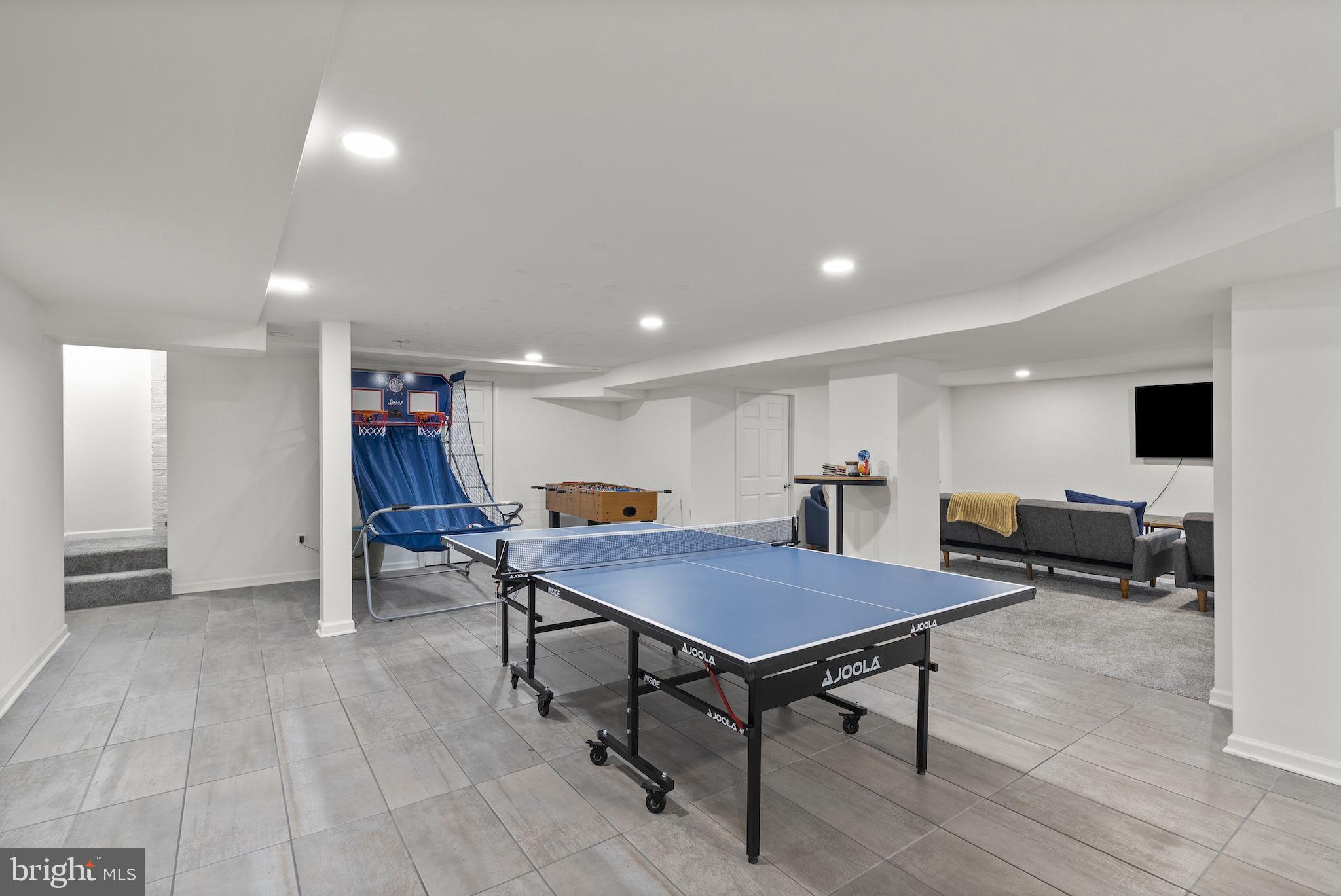 203 East Highfield Road Baltimore, MD 21218 - Photo 39 of 49 a living room with furniture and a flat screen tv