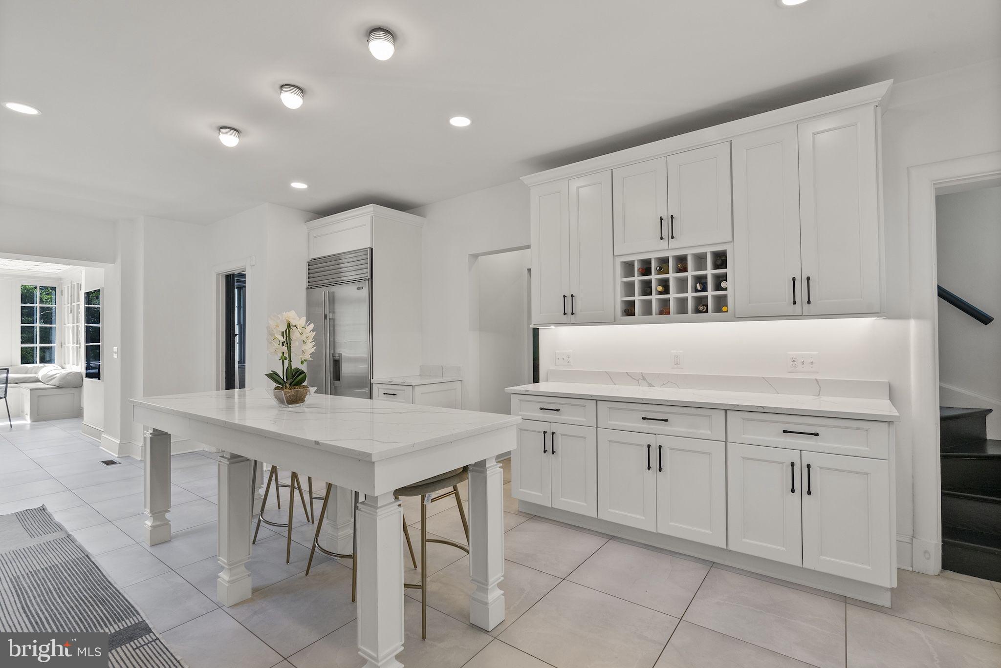 203 East Highfield Road Baltimore, MD 21218 - Photo 4 of 49 a kitchen with a sink table and chairs