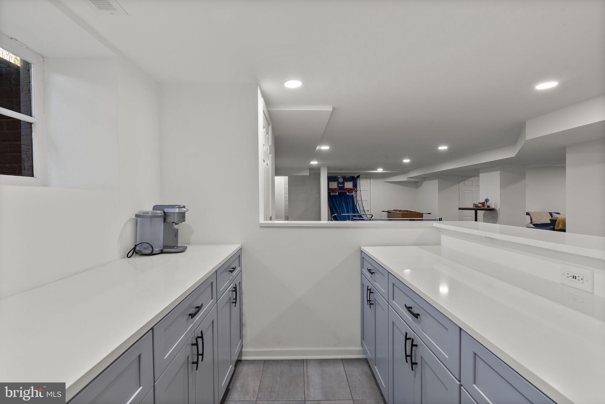 203 East Highfield Road Baltimore, MD 21218 - Photo 41 of 49 a kitchen with a sink and cabinets