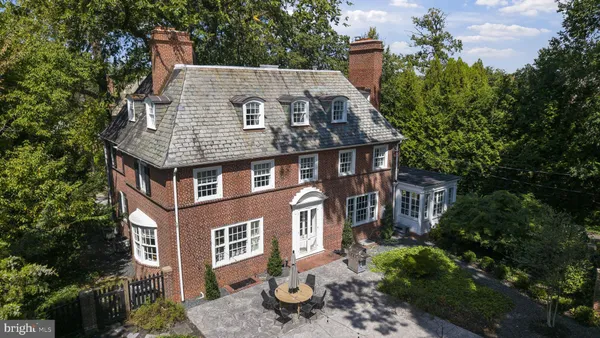 an aerial view of a house with a yard and potted plants