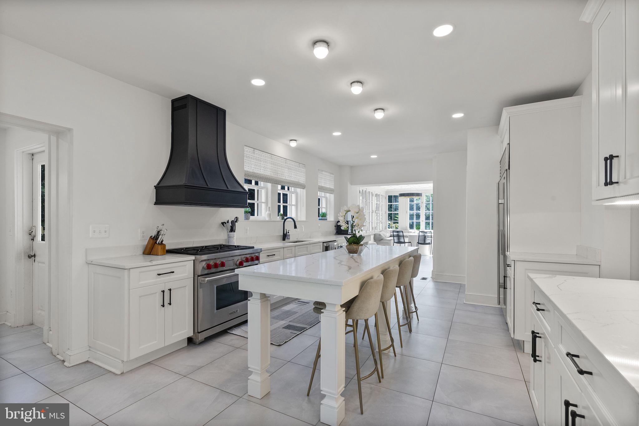 203 East Highfield Road Baltimore, MD 21218 - Photo 8 of 49 a kitchen with stainless steel appliances a sink stove and cabinets