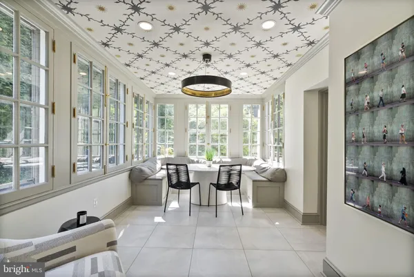 a lobby with furniture and large windows