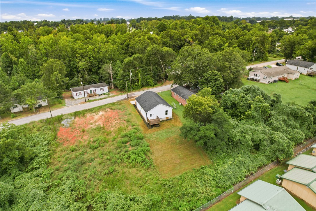 403 Tribble Street Seneca, SC 29678 - Photo 30 of 37 A quaint residence with a private yard, offering abundant potential for outdoor living and expansion.