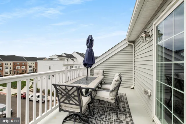 a view of a balcony with furniture