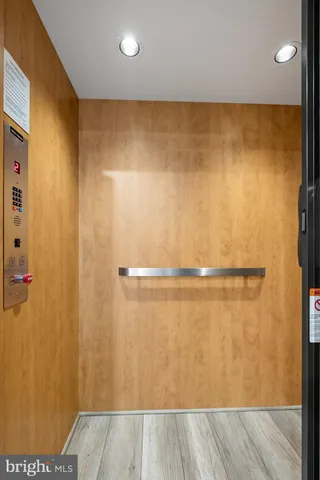 a view of a room with wooden door