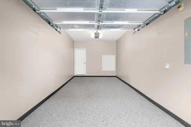 a view of a big room with chandelier fan