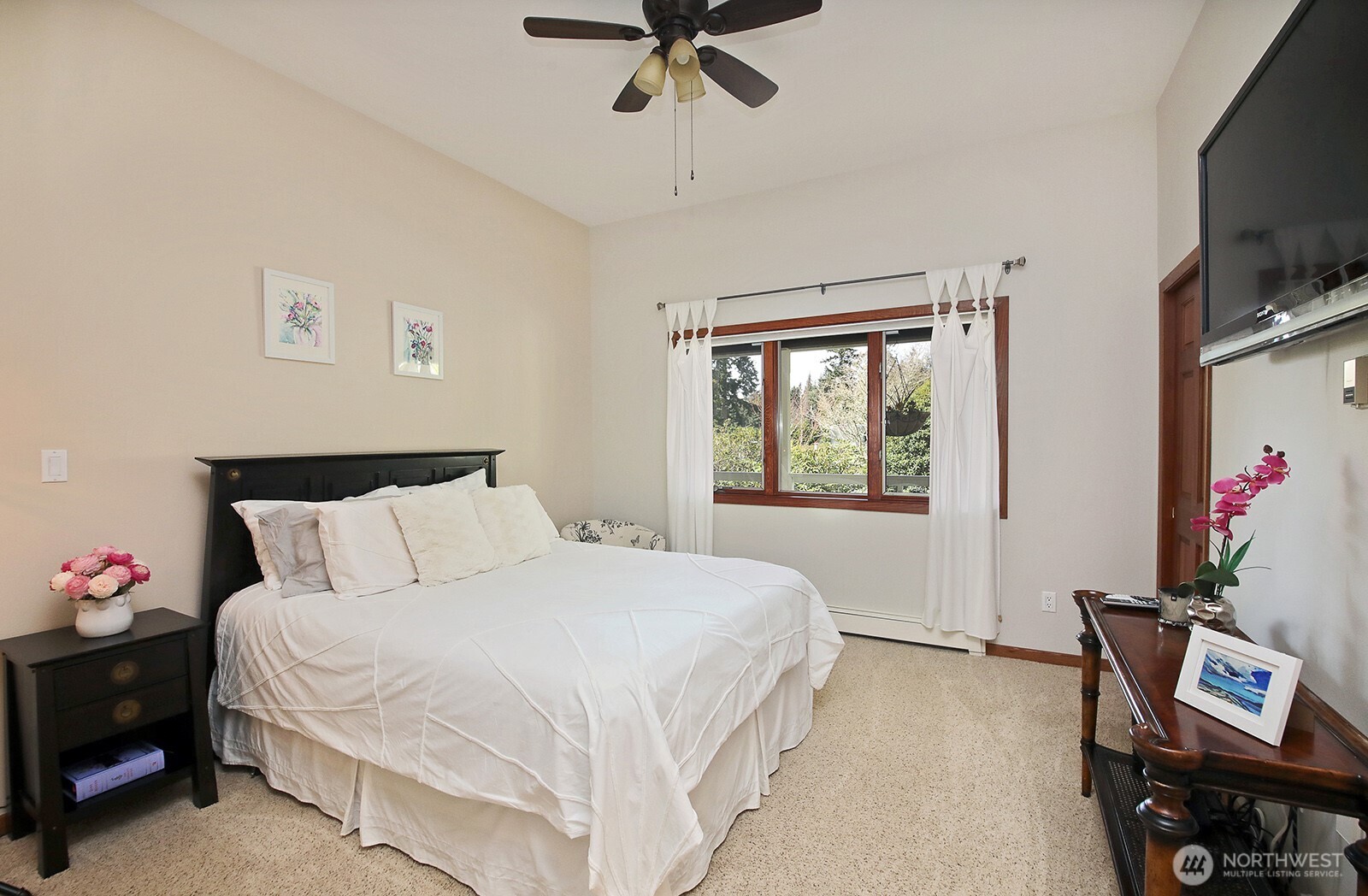 5741 Crow Haven Road Langley, WA 98260 - Photo 37 of 40 a bedroom with a bed and a window