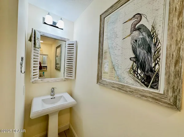 a bathroom with a sink a mirror and a shower